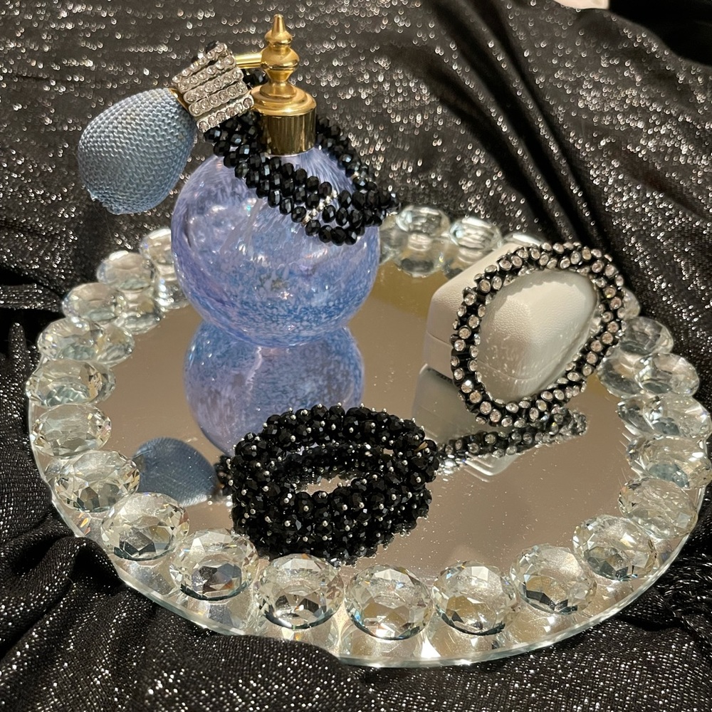 Three beautiful black, glittering, elasticized bracelets. Selling as a package.